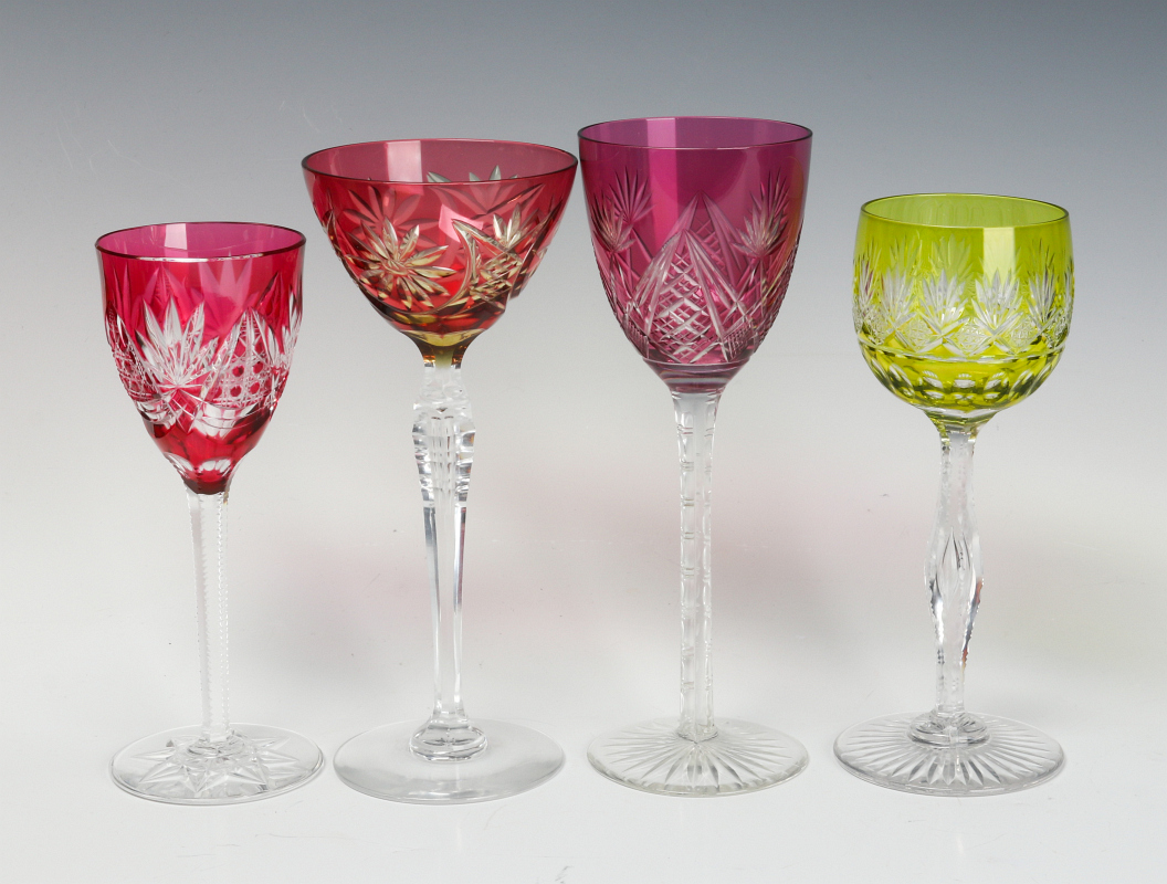 A COLLECTION OF COLORED CUT TO CLEAR CRYSTAL WINES