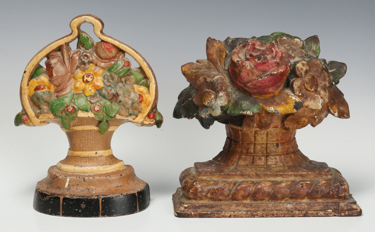 TWO CAST IRON FLOWER BASKET FIGURAL DOOR STOPS