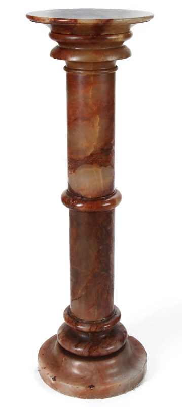 A CIRCA 1900 CARVED ONYX PEDESTAL