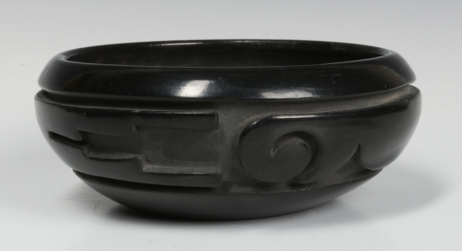 A DEEPLY CARVED SANTA CLARA BOWL BY S. CHAVARRIA