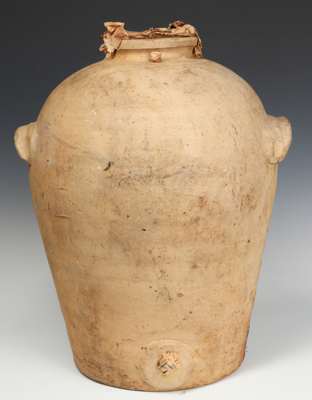 A 19TH CENTURY CONTINENTAL EARTHENWARE DISPENSER