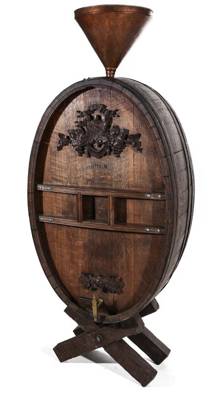 A LARGE 19TH CENTURY OVAL OAK COGNAC CASK ON STAND