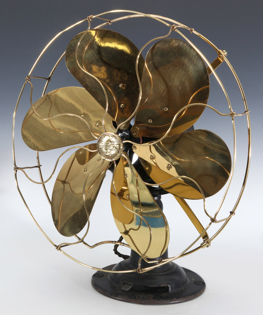 AN EMERSON ELECTRIC TABLE FAN WITH YOKE CIRCA 1914