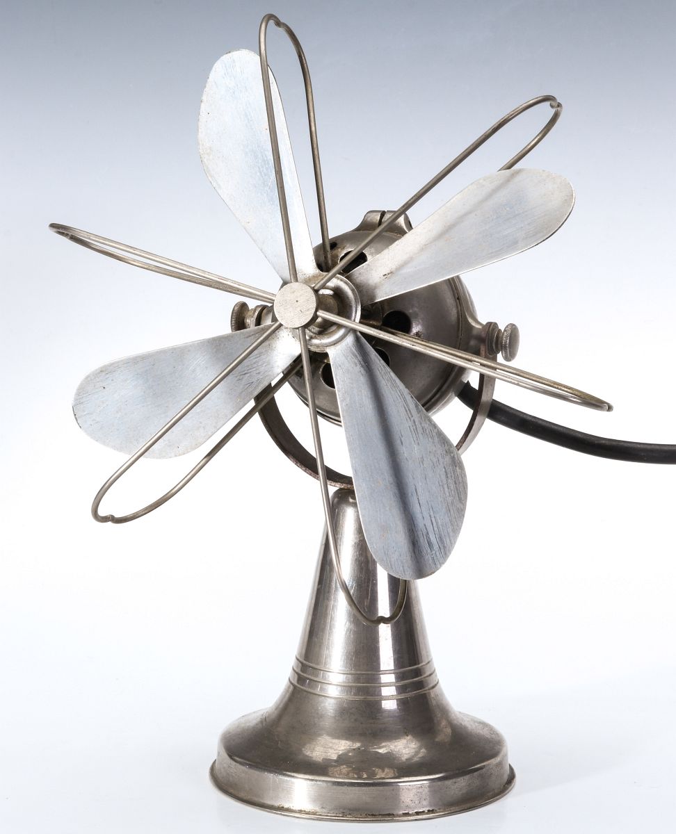 AN UNUSUAL MACHINE AGE NICKEL PLATED TABLE FAN