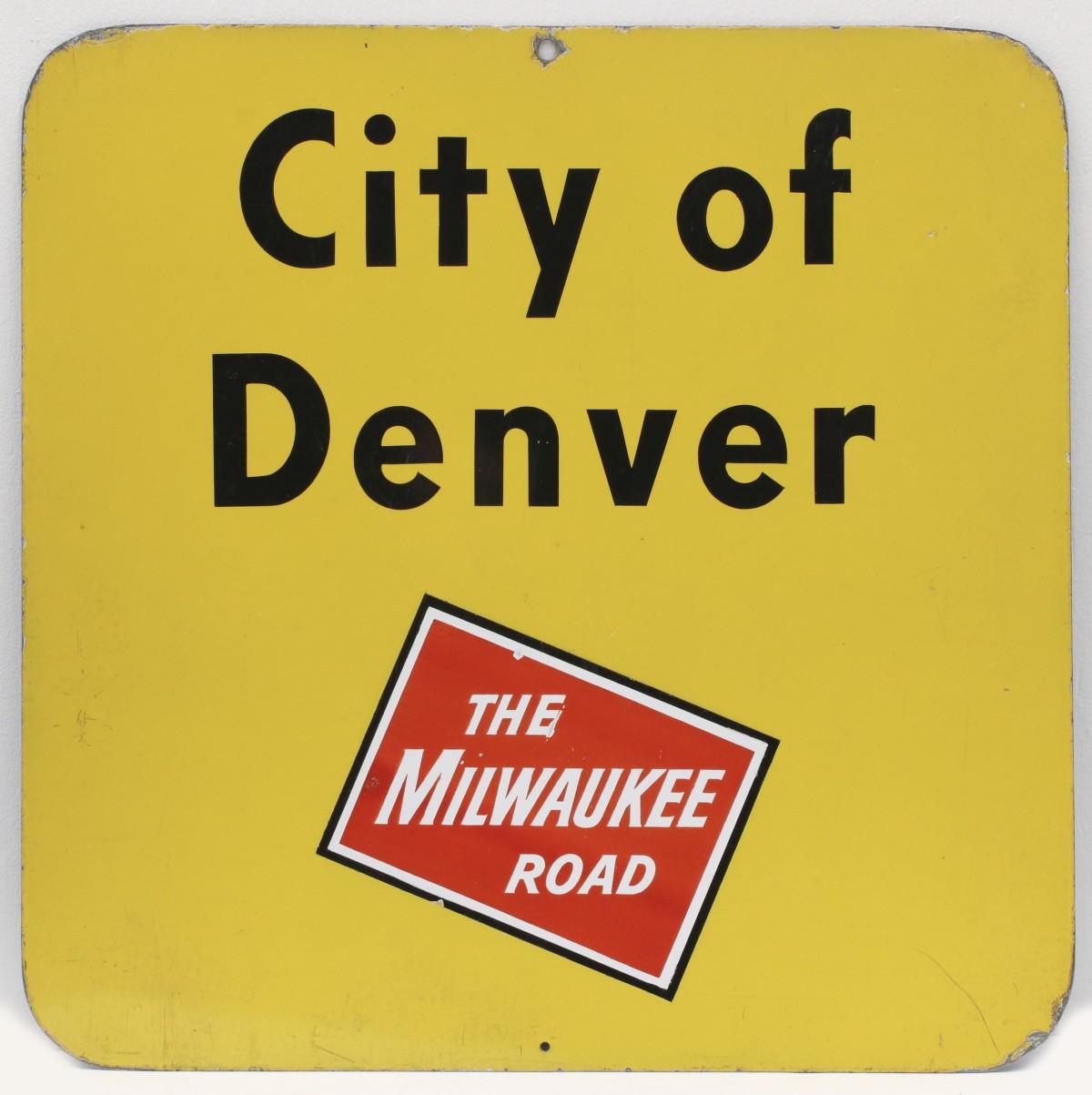 A GATE SIGN FOR THE CITY OF DENVER ON MILWAUKEE ROAD