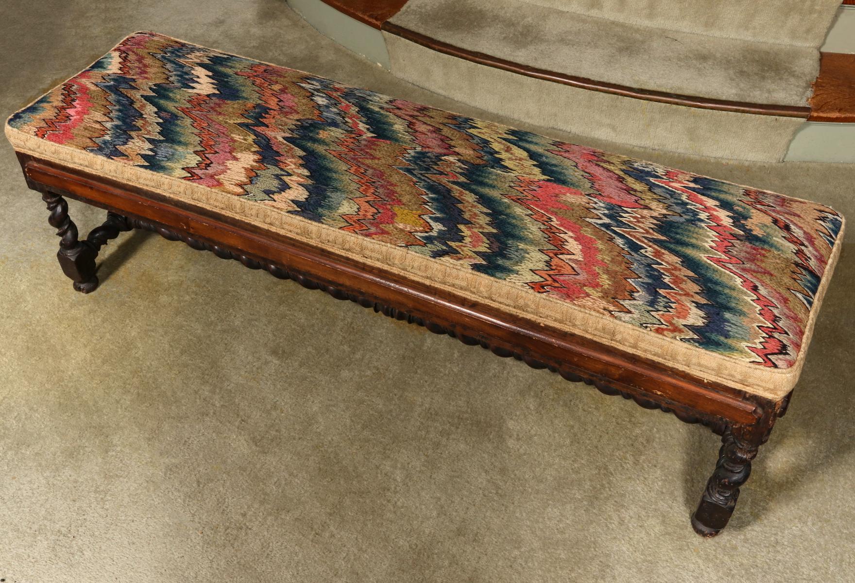 A 17TH CENTURY ITALIAN WALNUT FIRESIDE BENCH