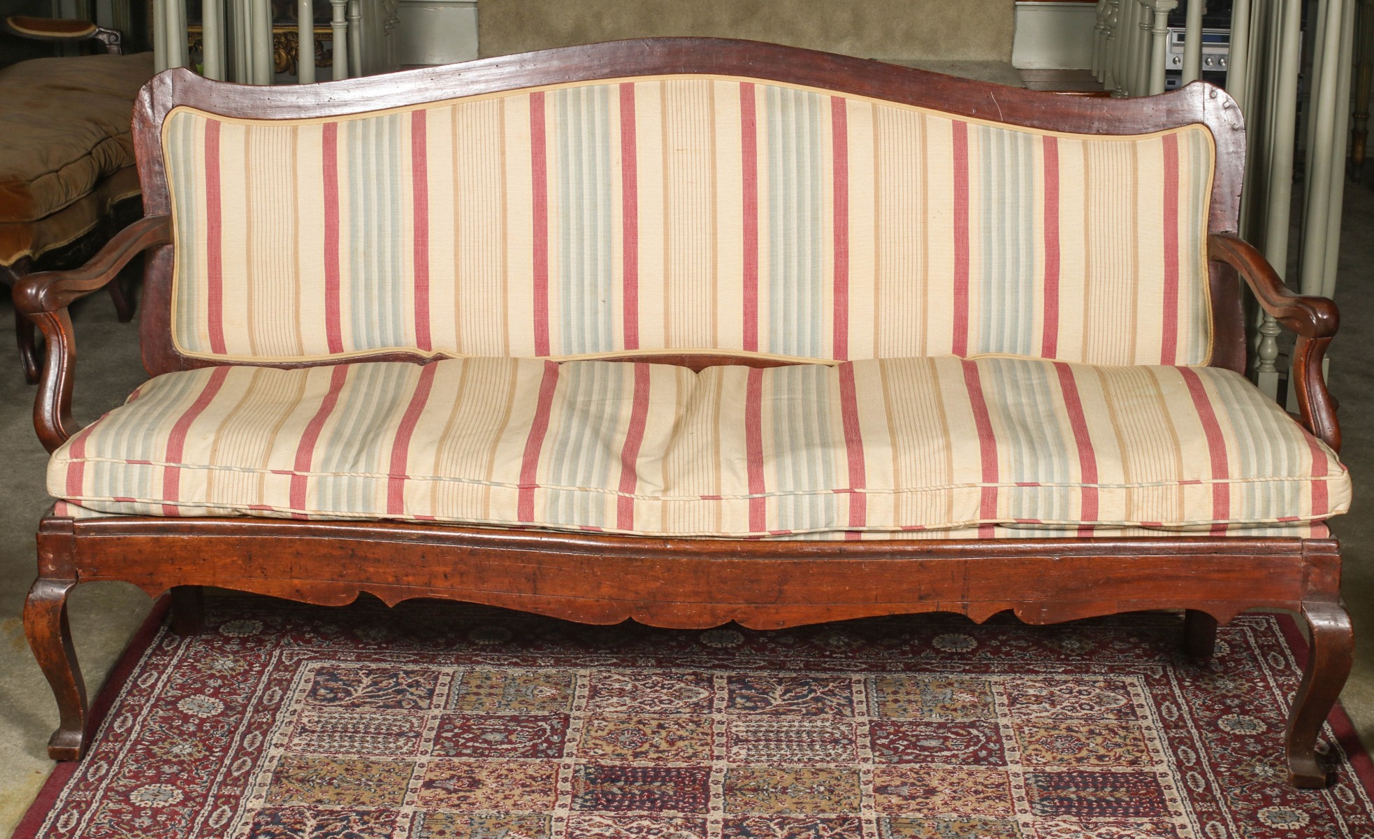 AN ITALIAN 18TH CENTURY FRUITWOOD LONG SOFA