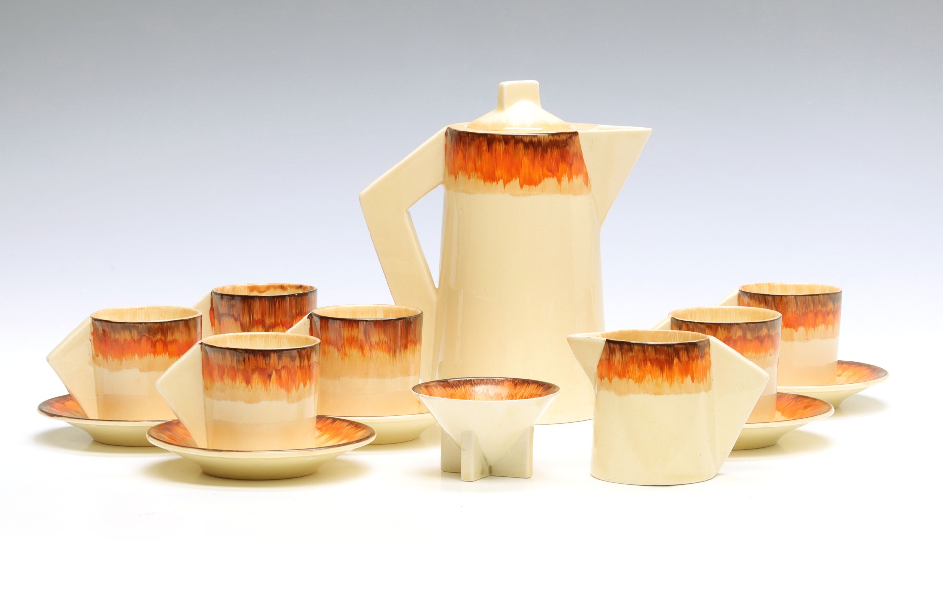 A CLARICE CLIFF 'AURA' PATTERN DEMITASSE SET