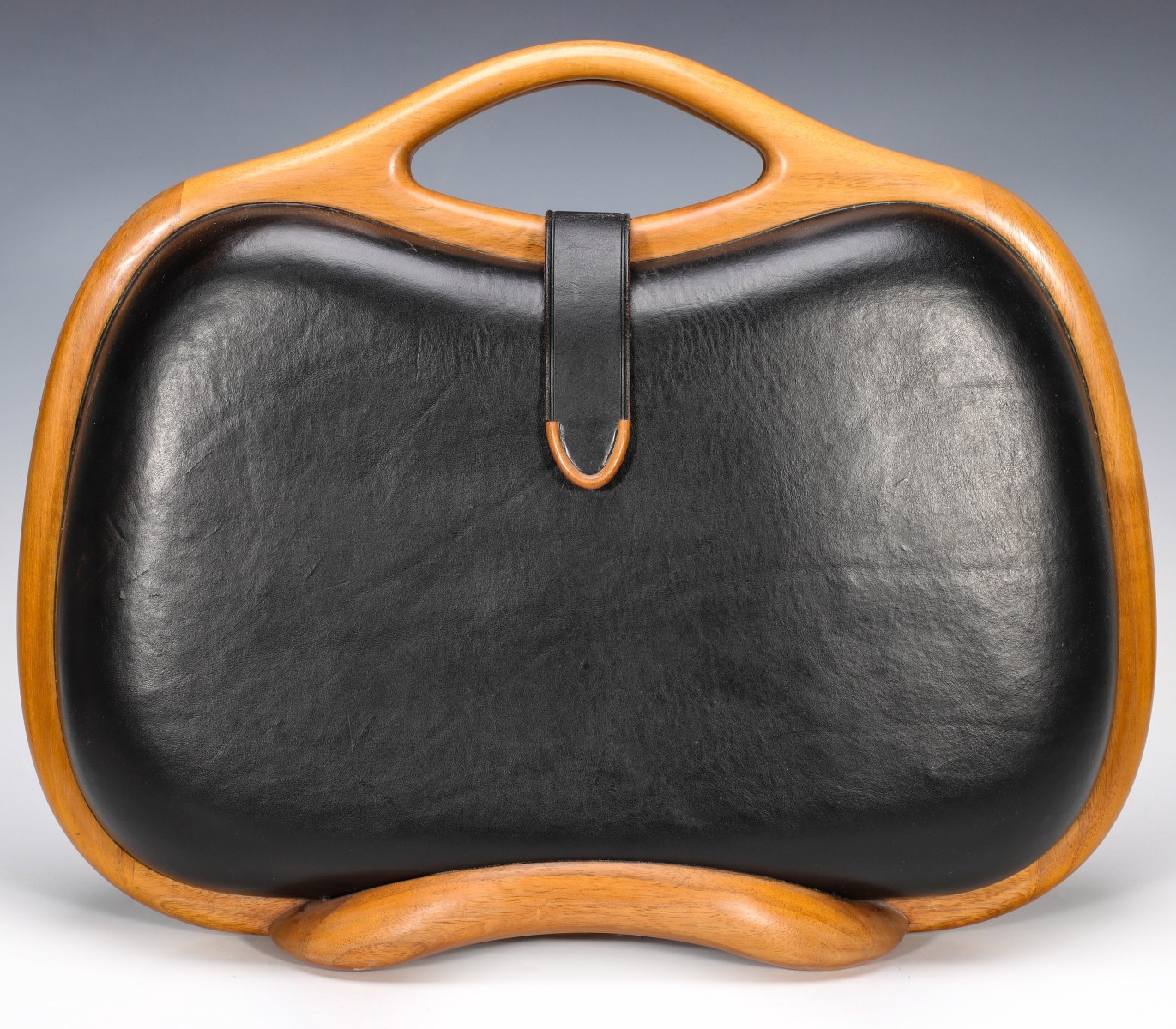 A STEPHEN OWEN BLACK LEATHER AND TEAK CASE