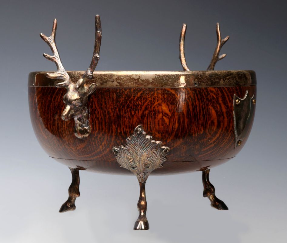 AN OAK CENTERPIECE WITH SILVER PLATED STAG MOUNTS