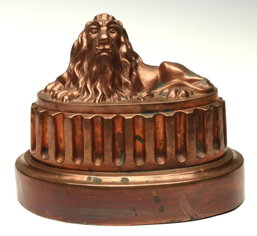 A BENHAM & FROUD COPPER LION FORM FOOD MOLD