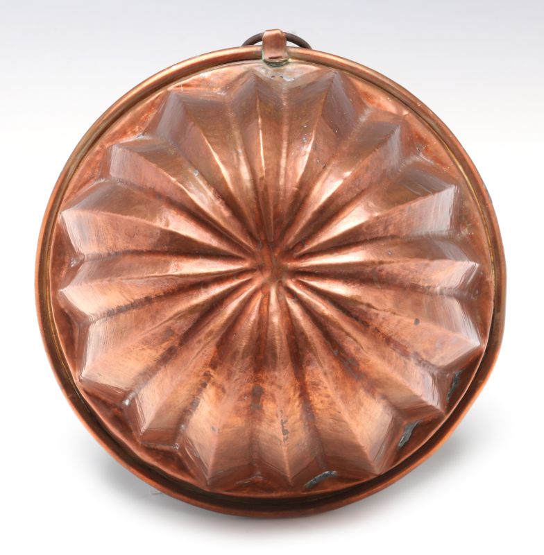 AN ANTIQUE COPPER FOOD MOLD