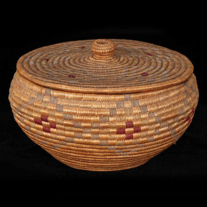 AN INUIT ESKIMO COVERED BASKET