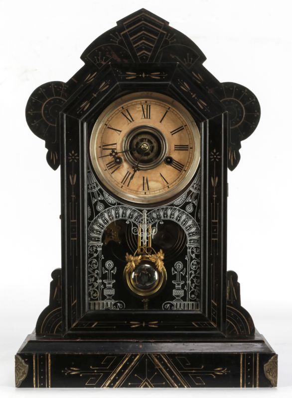 A WM. GILBERT 'MERL' GESSOED AND EBONISED CLOCK