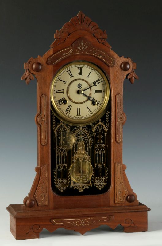 A WATERBURY WALNUT PARLOR CLOCK