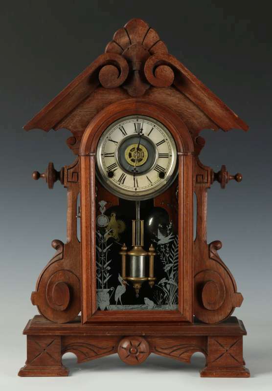 A NICE WALNUT FANCY PARLOR CLOCK