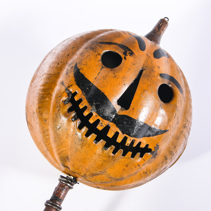 A RARE PAINTED TIN JACK-O-LANTERN PARADE TORCH