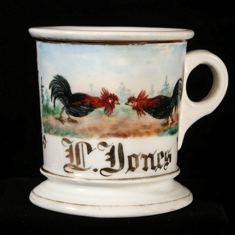 AN OCCUPATIONAL SHAVING MUG WITH FIGHTING COCKS