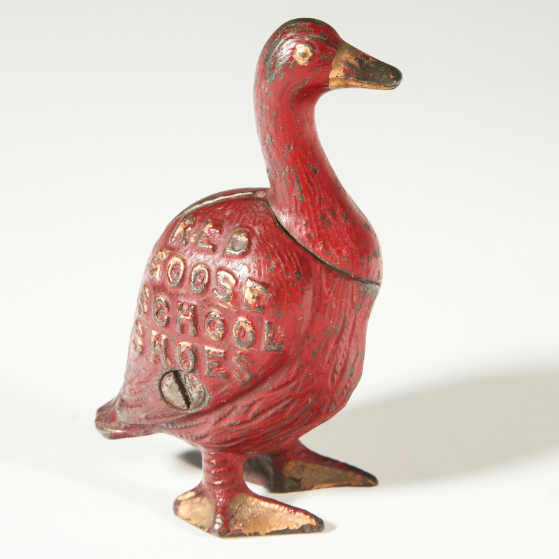 A GOOD ORIGINAL RED GOOSE SHOES CAST IRON BANK