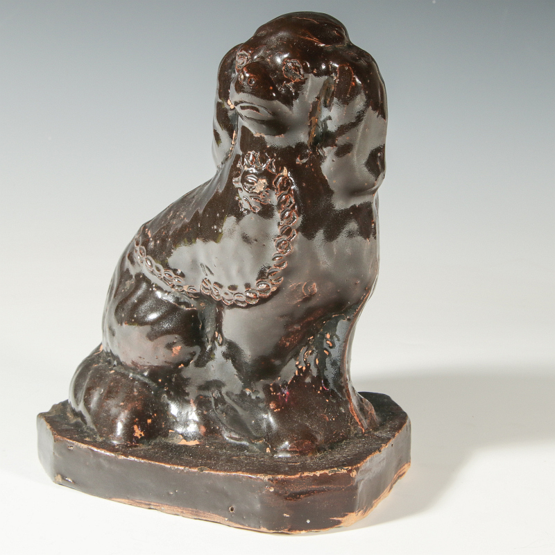 A MIDWEST STONEWARE SPANIEL, POSSIBLY MISSOURI 