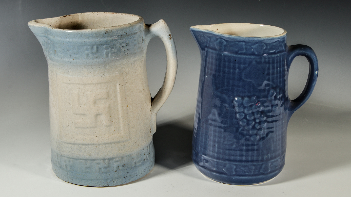 TWO BLUE AND WHITE STONEWARE PITCHERS CIRCA 1920