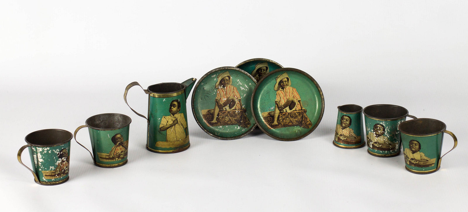 A BLACK AMERICANA TIN LITHO TEA SET