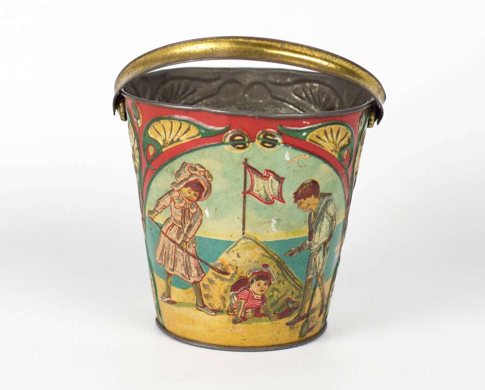 AN ANTIQUE TIN LITHO SAND PAIL WITH TEDDY BEAR