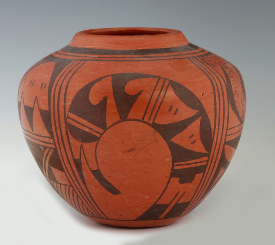 A RED HOPI POTTERY JAR SIGNED FRIEDA POLEAHLA 