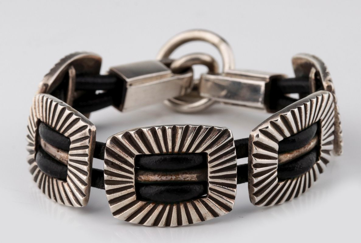 AN ARNOLD GOLDSTEIN STERLING CONCHO BRACELET