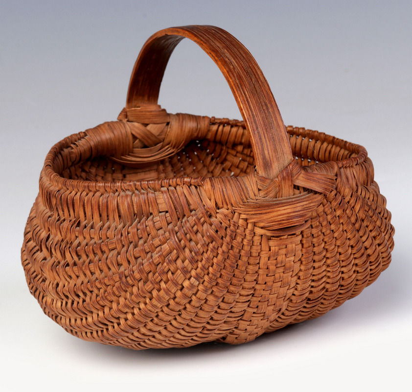 A GOOD 19TH C. AMERICAN MINIATURE BUTTOCKS BASKET