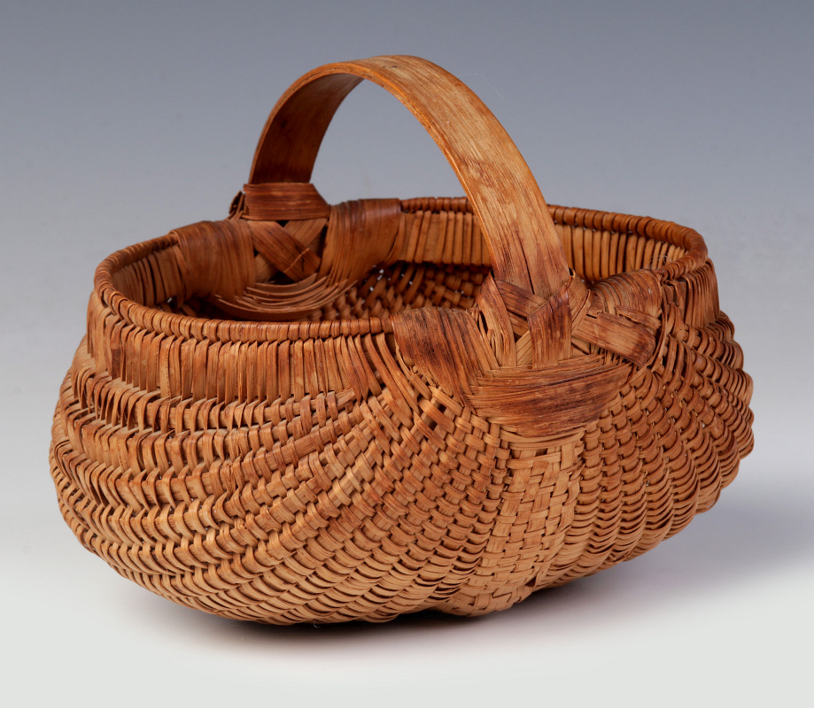 A 19TH CENTURY AMERICAN MINIATURE BUTTOCKS BASKET