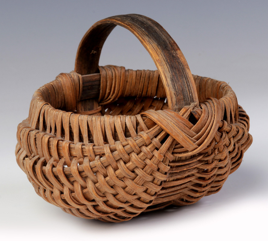 A 19TH CENTURY AMERICAN MINIATURE BUTTOCKS BASKET