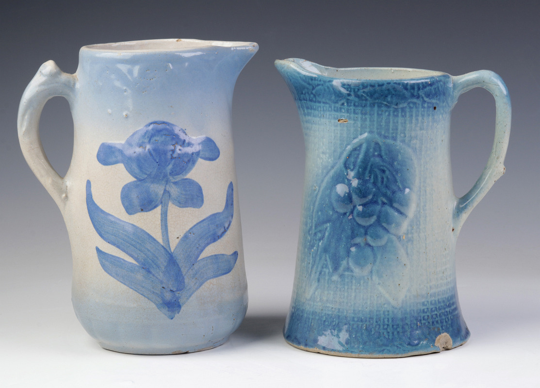 TWO BLUE AND WHITE STONEWARE PITCHERS