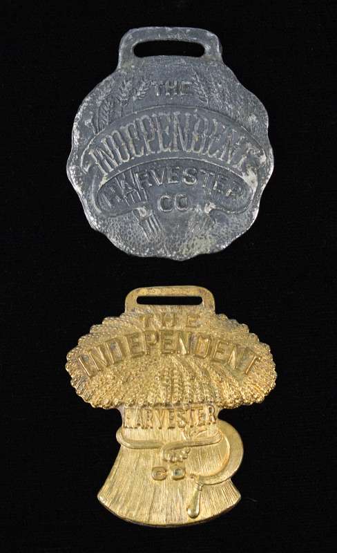 TWO INDEPENDENT HARVESTERS ADVERTISING WATCH FOBS 