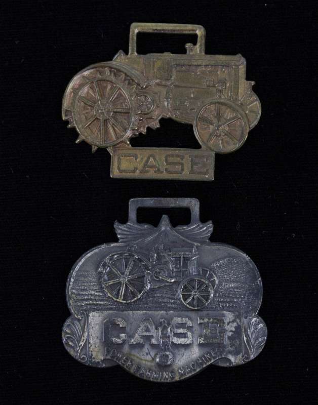 TWO J.I. CASE MACHINERY ADVERTISING WATCH FOBS