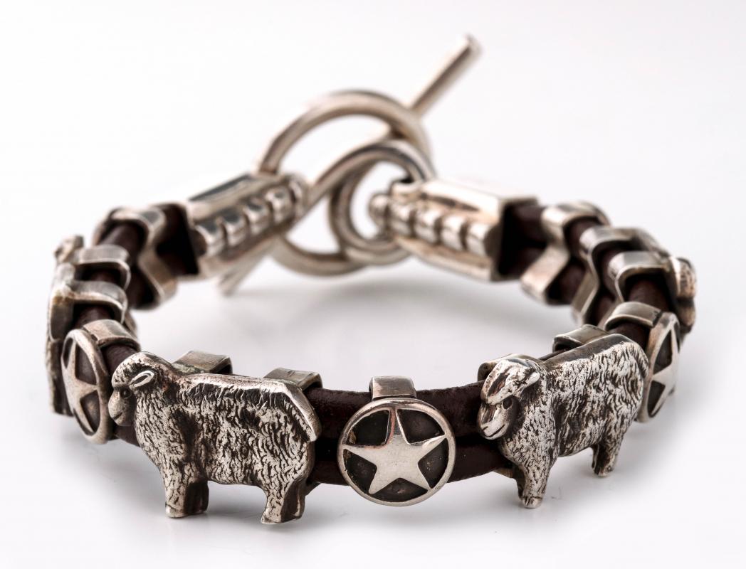 AN ARNOLD GOLDSTEIN STERLING CONCHO BRACELET