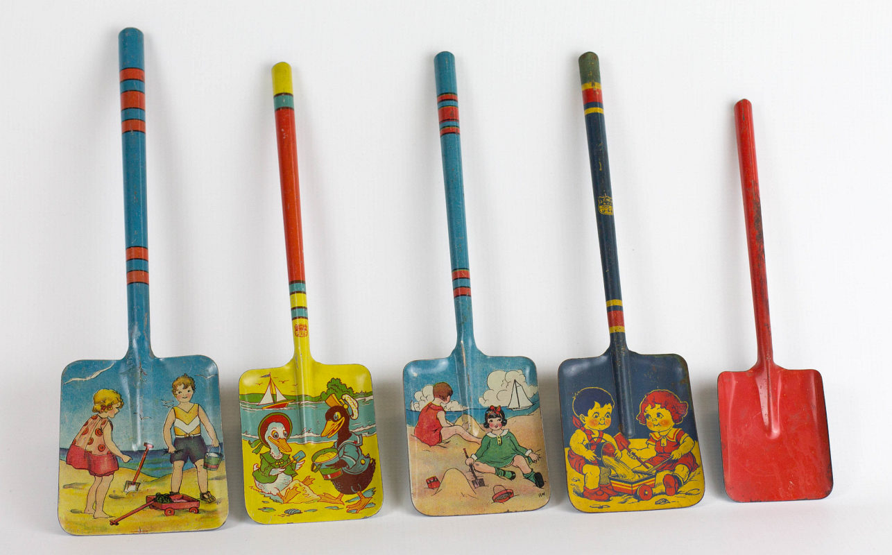 FIVE TIN LITHO SAND SHOVELS