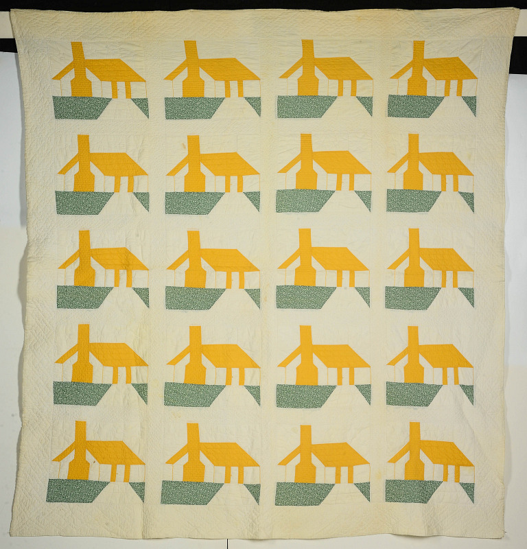 A VINTAGE HOUSE BLOCK QUILT