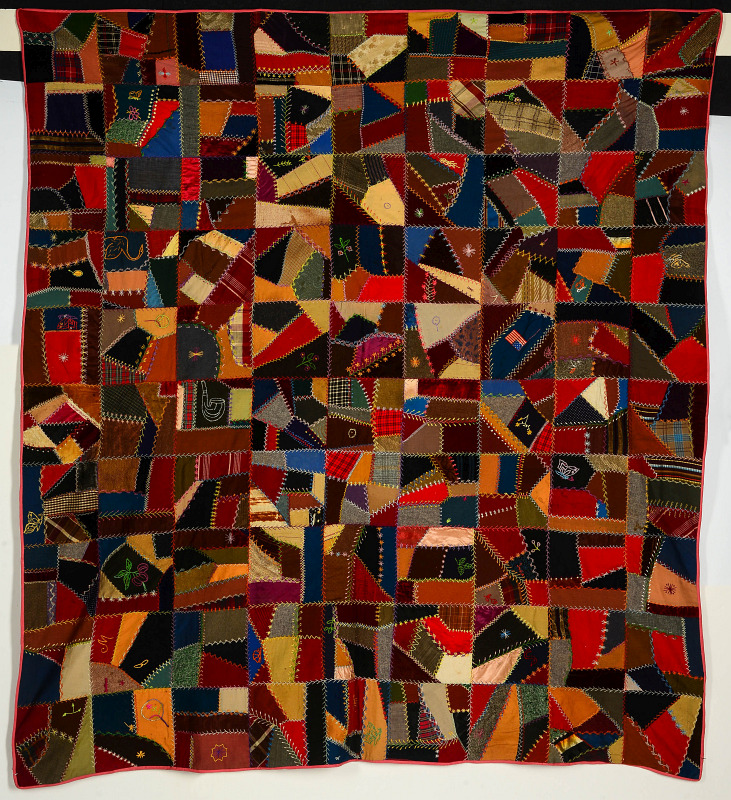 AN ANTIQUE CRAZY QUILT DATED 1906