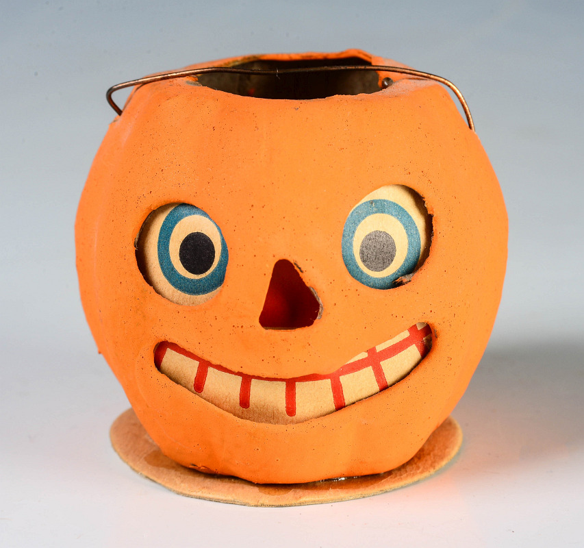 A GERMAN PRESSED PAPER JACK-O-LANTERN