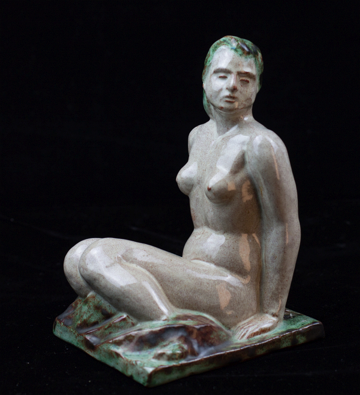 AN ART MODERNE TERRA COTTA SEATED NUDE