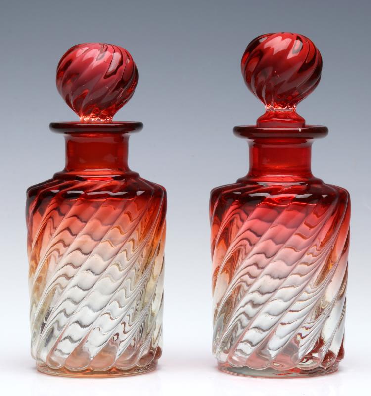 A PAIR CIRCA 1900 BACCARAT ROSE TIENTE COLOGNE BOT