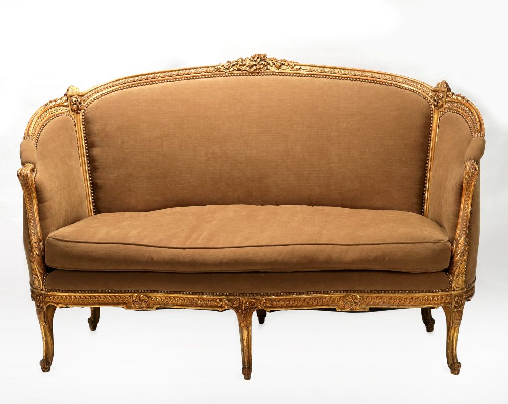 A CIRCA 1900 LOUIS XVI CARVED AND GILDED SOFA