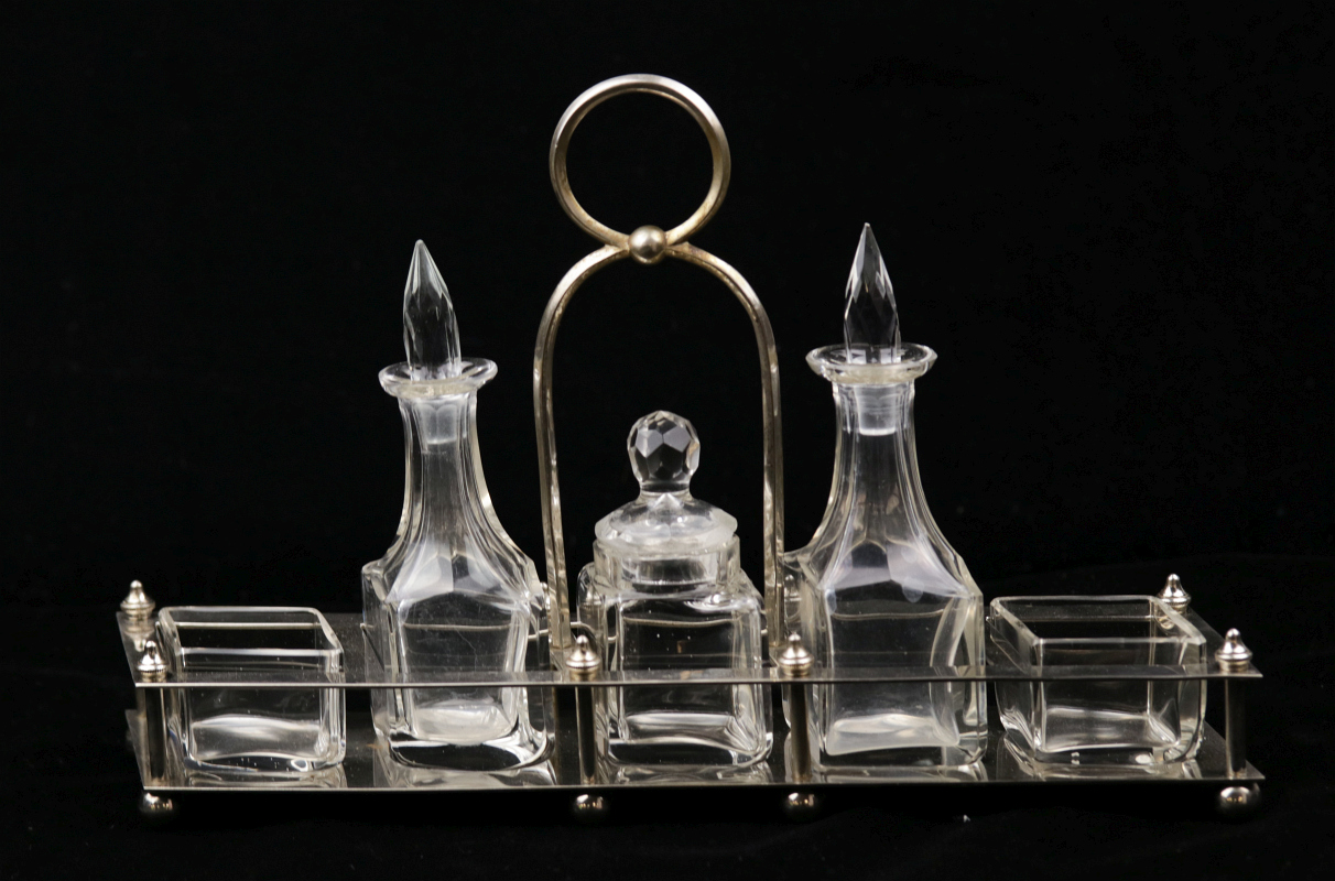 A WMF CRUET SET WITH CUT CRYSTAL 