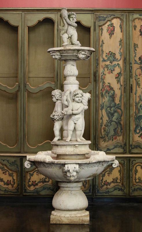 A NEOCLASSICAL MARBLE FOUNTAIN WITH PUTTO, 9 FEET 