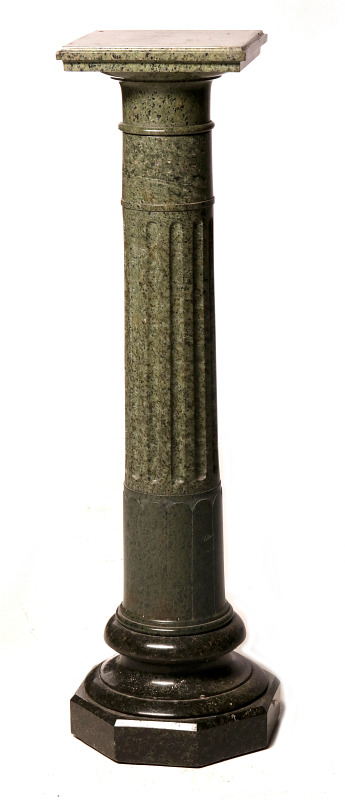 A GREEN GRANITE COLUMNAR PEDESTAL 