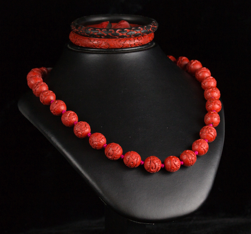 CARVED CINNABAR NECKLACE AND BANGLE BRACELETS