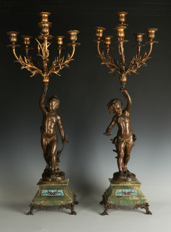 A PAIR OF EARLY 20TH C BRONZE PUTTO CANDELABRA WITH 