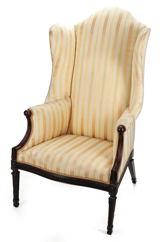 A GEORGE III HEPPLEWHITE WING BACK CHAIR