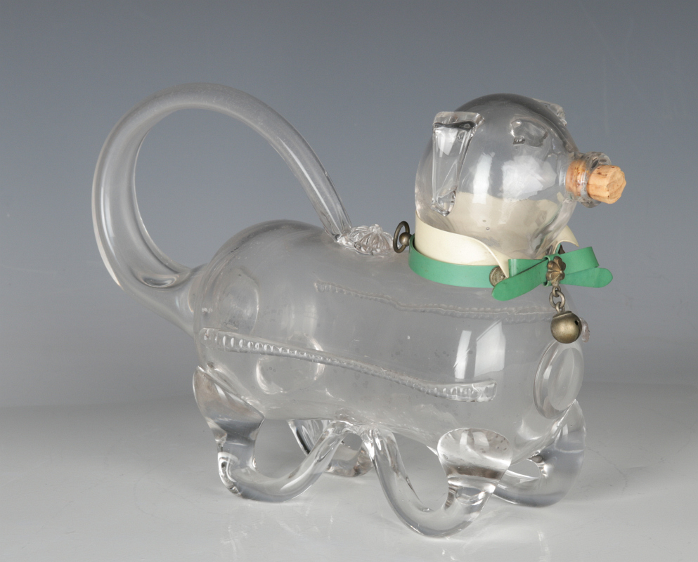 A FIGURAL PIG BLOWN GLASS CLARET JUG